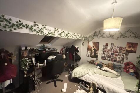 A cozy and well-used living room featuring a co...