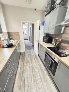 A modern, well-maintained kitchen with ample st...