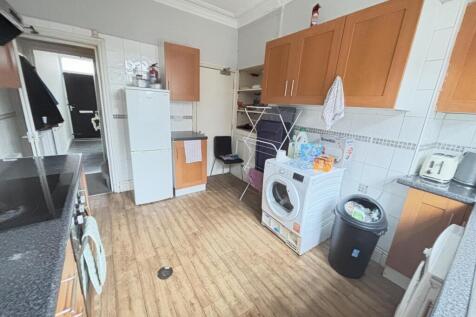 A functional kitchen area featuring essential a...