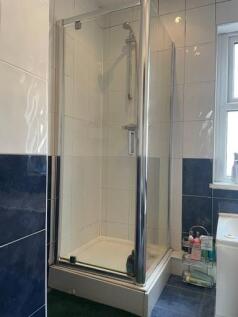 A clean, well-maintained shower enclosure featu...