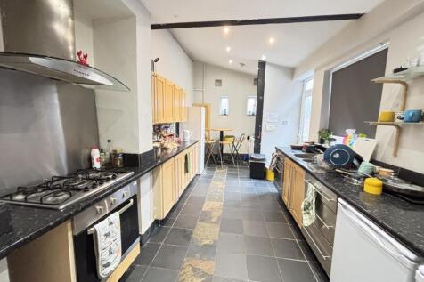 Modern and well-maintained kitchen with ample c...