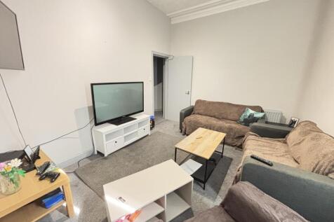 A cozy and inviting living room featuring comfo...