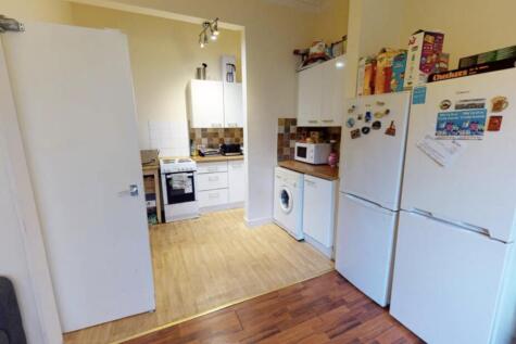 A cozy, well-maintained kitchen area with good ...