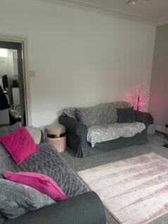 Bright and inviting living room featuring comfo...