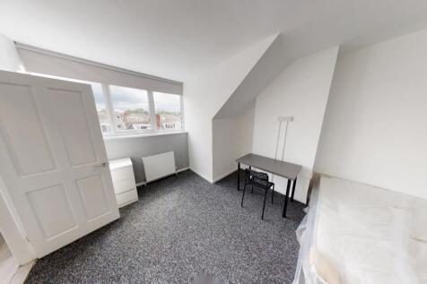 Spacious and bright master bedroom with ample n...