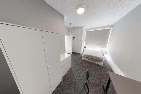 A bright, well-maintained bedroom with a clean ...