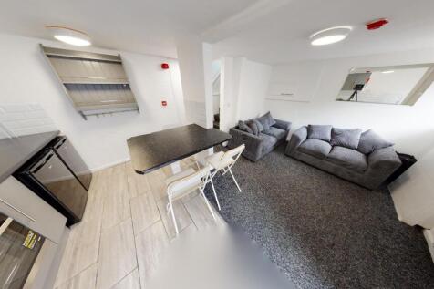 A spacious and modern living room featuring a l...