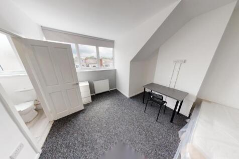 Bright and clean bedroom with good natural ligh...