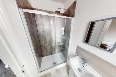 A clean and well-maintained bathroom featuring ...