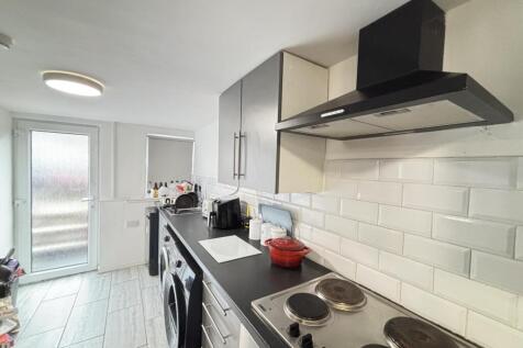 Modern and well-maintained kitchen with ample c...