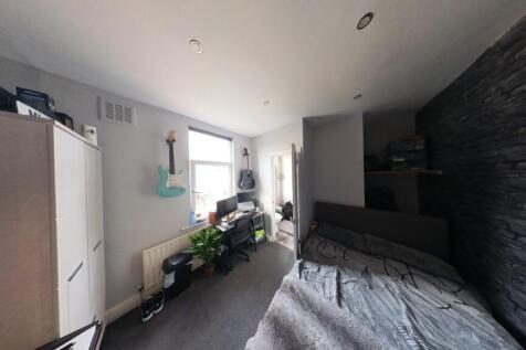 A bright and well-maintained bedroom filled wit...