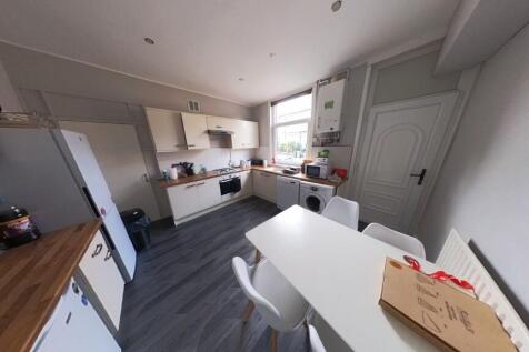 Bright and modern kitchen with ample natural li...