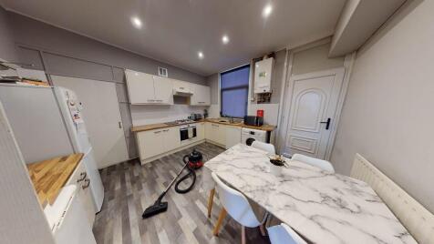 A modern, well-lit kitchen with ample workspace...