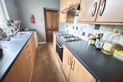 A well-maintained modern kitchen featuring wood...