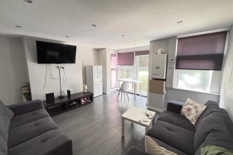 Bright and spacious living room featuring comfo...