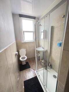A clean, well-maintained bathroom featuring a s...