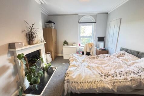 A spacious and well-maintained master bedroom f...