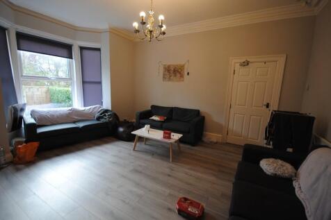 A spacious and well-maintained living room feat...