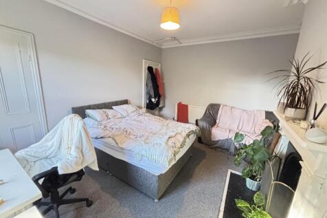 A spacious and well-maintained master bedroom f...