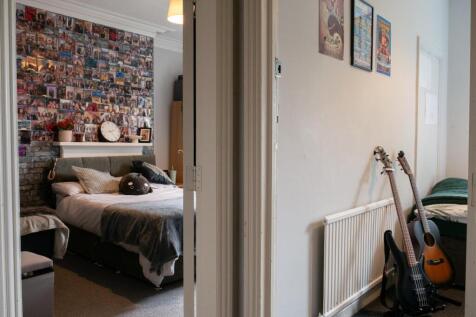 A bright and welcoming living room featuring a ...