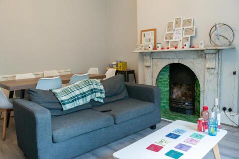 A welcoming living room featuring a comfortable...