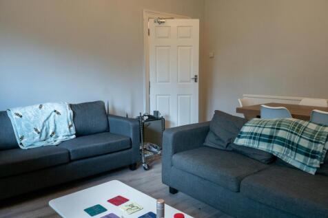 A modern, well-maintained living room featuring...