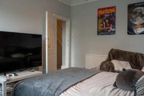 A spacious and well-maintained master bedroom f...