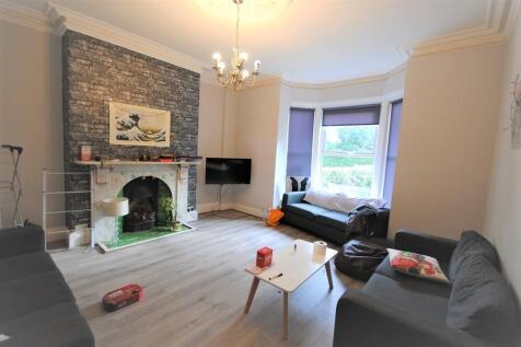 Bright and inviting living room with a large wi...