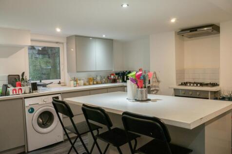 Modern and bright kitchen with ample counter sp...