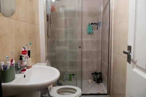 A clean and well-maintained bathroom with a lar...