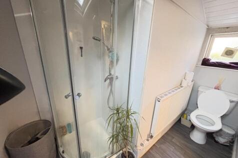A clean and well-maintained bathroom featuring ...