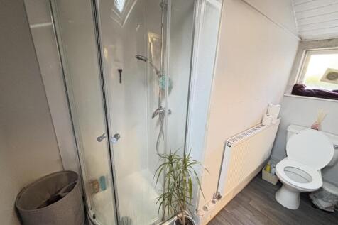 A clean and well-maintained bathroom featuring ...