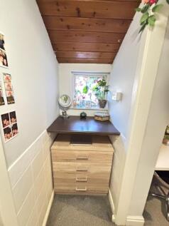 A bright and clean bathroom featuring a window ...