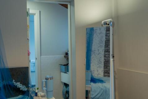 A clean and well-maintained bathroom with a spa...