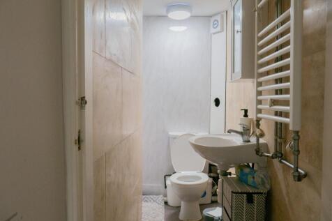 A clean and functional bathroom featuring a toi...