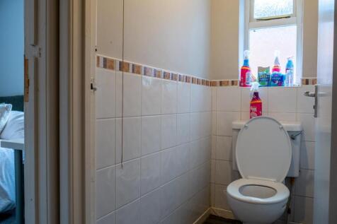 A clean and functional bathroom with a toilet a...