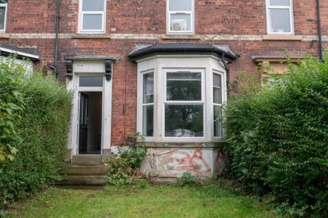 A charming exterior view of a traditional brick...