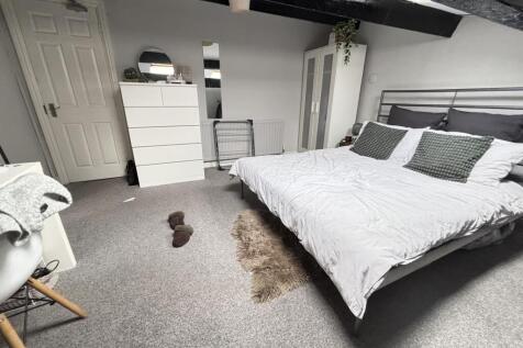 A spacious and well-maintained master bedroom f...