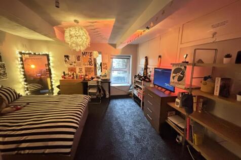 A cozy and inviting living room featuring conte...