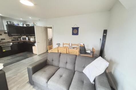 A bright and modern living room featuring a com...