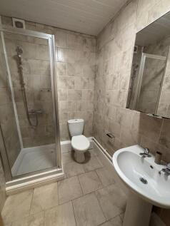 A clean and well-maintained bathroom featuring ...