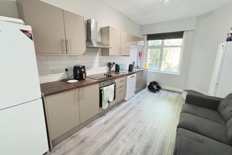 Bright and modern living room with ample natura...