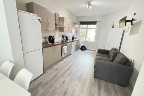 A bright and modern living room featuring a com...