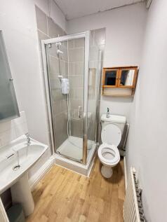 A well-maintained bathroom featuring a modern s...