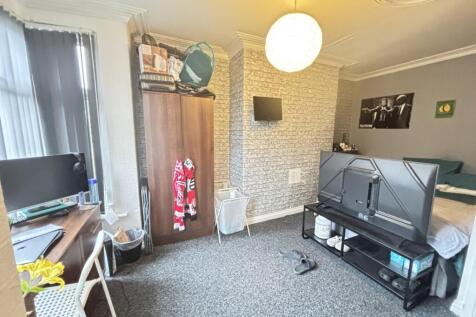 A contemporary living room with a cozy atmosphe...