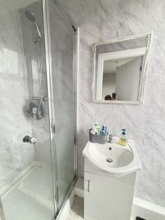 A clean, well-maintained bathroom featuring a m...