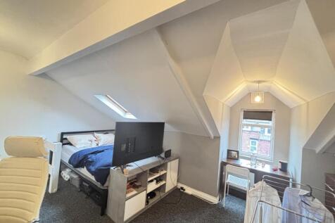 Bright attic double bedroom with sloped ceiling...