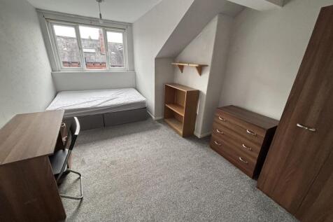 A cozy, well-maintained single bedroom with nat...