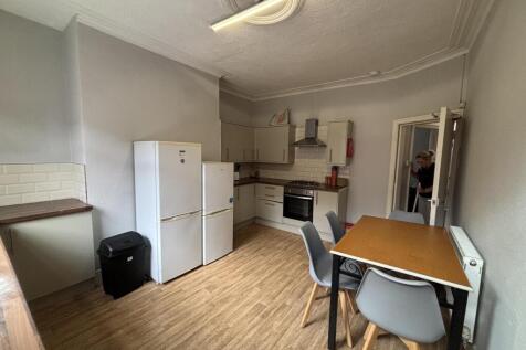 A tidy and well-lit interior space featuring ba...