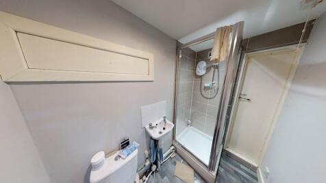 A clean and modern bathroom suite featuring a s...